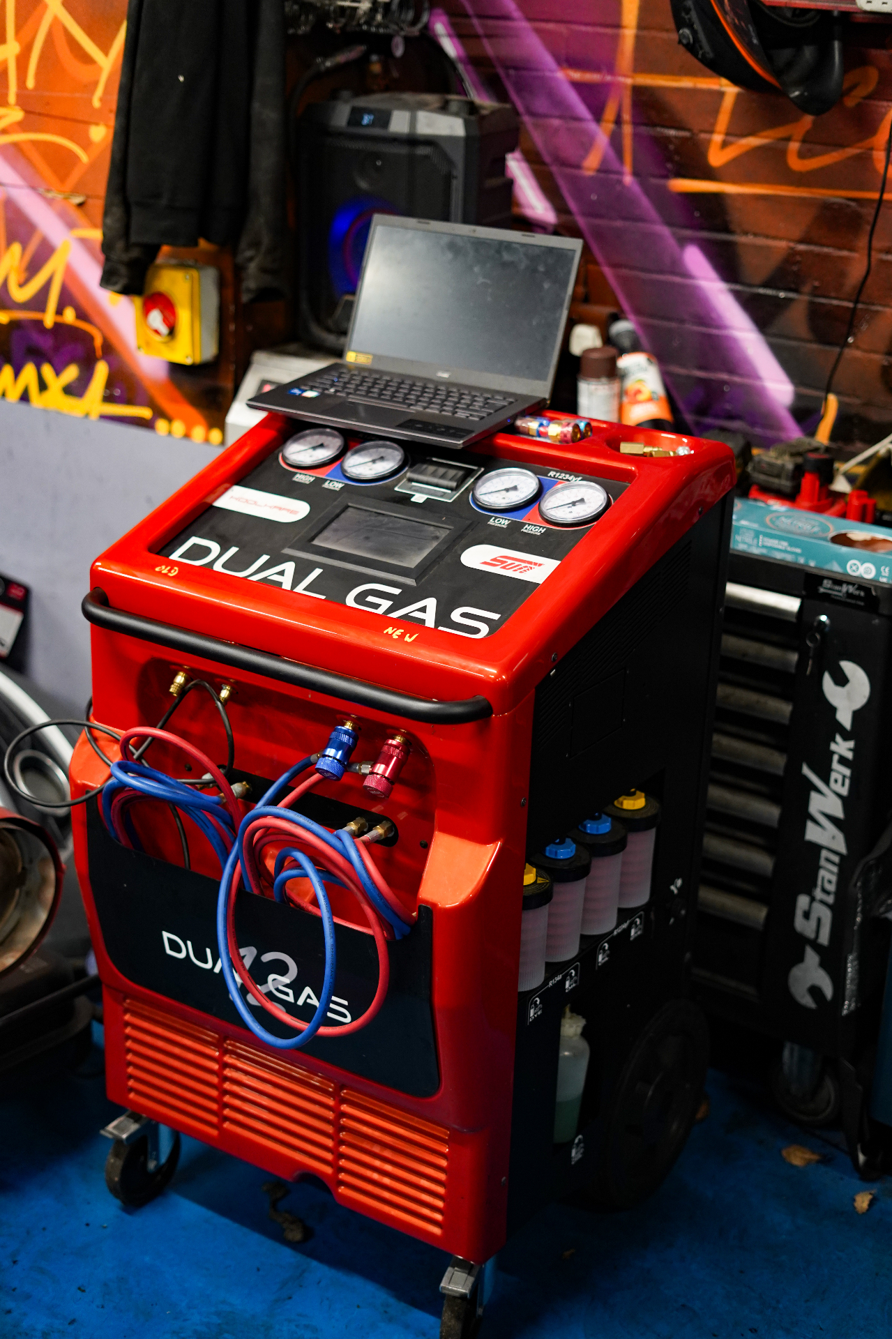 Dual Gas air conditioning regas machine with pressure gauges at EcoMax workshop
