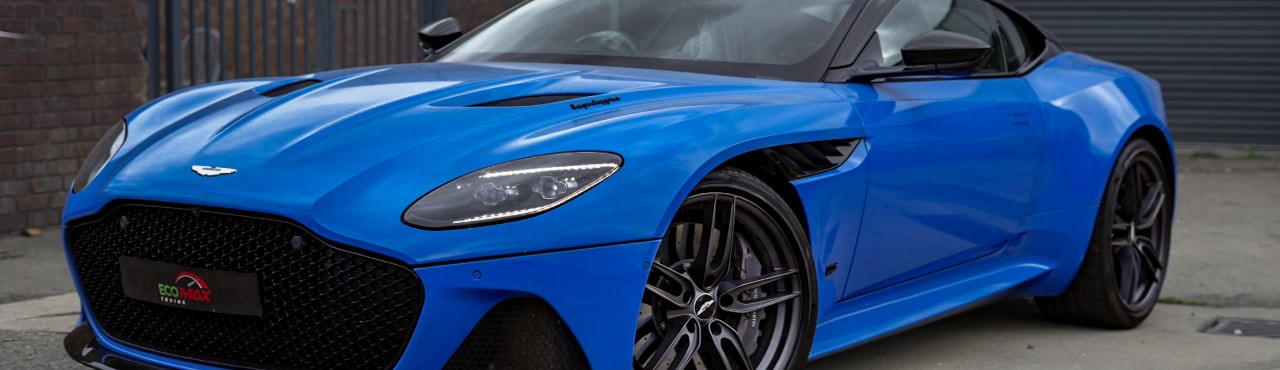 Blue Aston Martin DBS Superleggera parked outside the EcoMax Tuning workshop in Peterborough